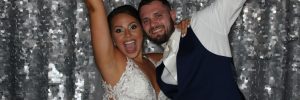 Bride and Groom Celebrating in a Wedding Photo Booth