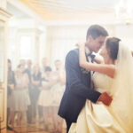 bride and groom dancing together at wedding reception