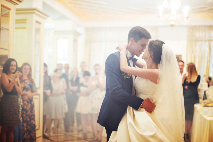 bride and groom dancing together at wedding reception