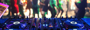 music controller DJ mixer in a night club at a live electronic music concert